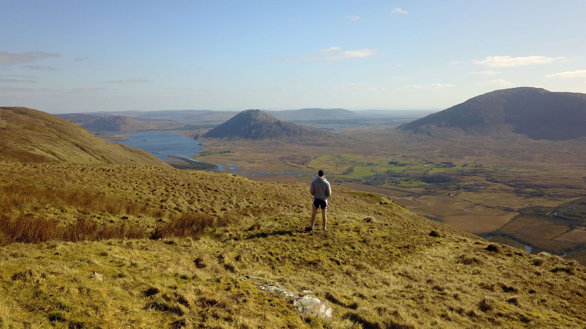 Eamon Keane looking out over Maum valley from the top of Log na Brice Mountain